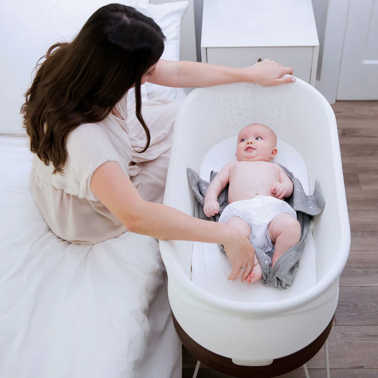 mother with baby in snoo